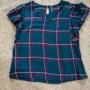 Short sleeved plaid pullover blouse.
